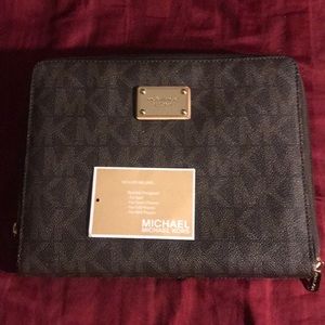 selling a Michael Kors clutch and ipad holder